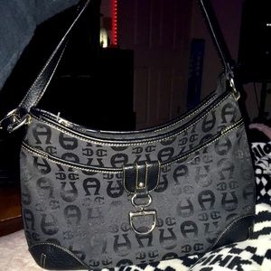 This is a black , Etienne Aigner purse